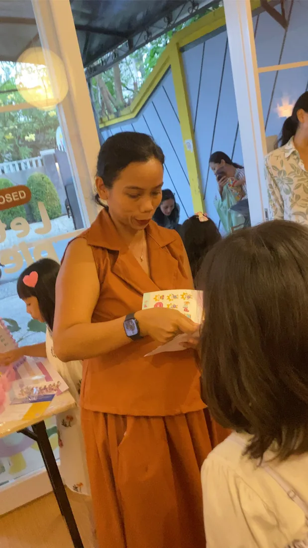 Storyteller reading aloud at PLEY x KEBI